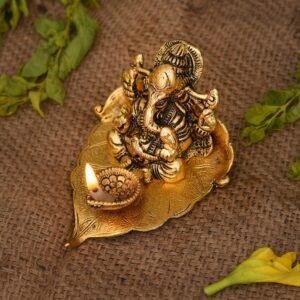 Ganesh Idol on Leaf - Lord Ganesha with Diya