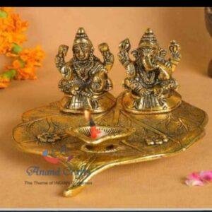 Ganeshji and Laxmi diya on big leaf